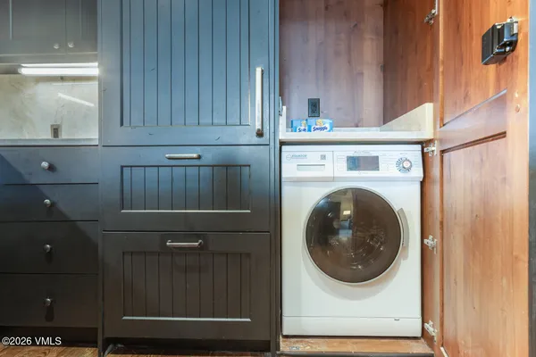 a utility room with dryer and washer