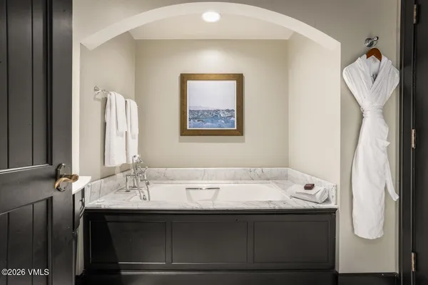 a bathroom with a sink and mirror