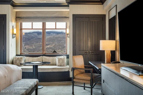 a living room with a couch and a window