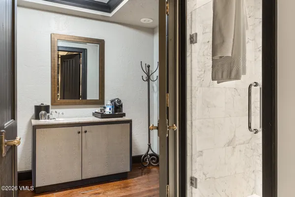 a bathroom with a sink and a mirror