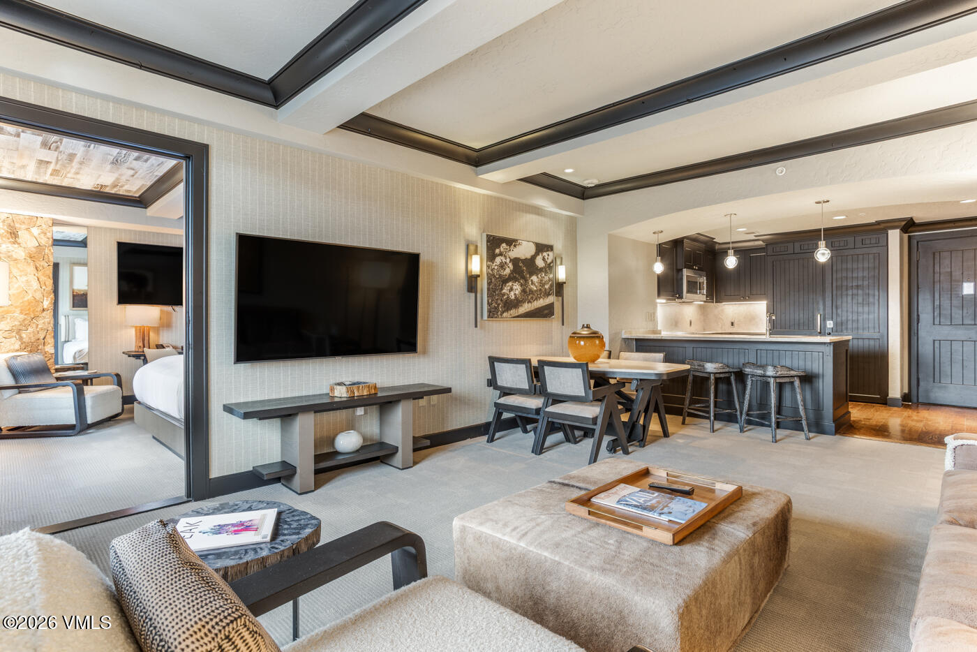 130 Daybreak Ridge Road, Unit HS725 Avon, CO 81620 - Photo 7 of 38 a living room with furniture and a flat screen tv