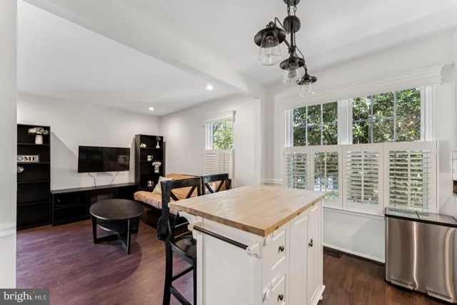 a view of a livingroom with furniture and a window