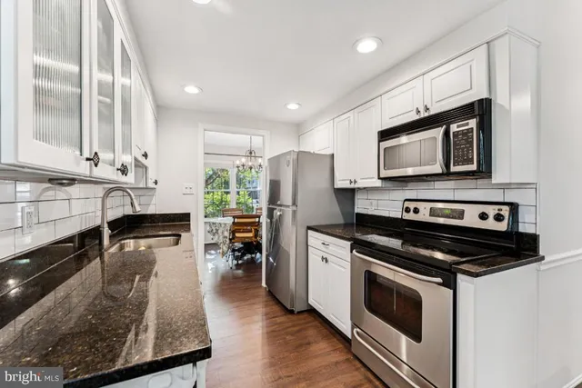 a kitchen with a stove and a microwave