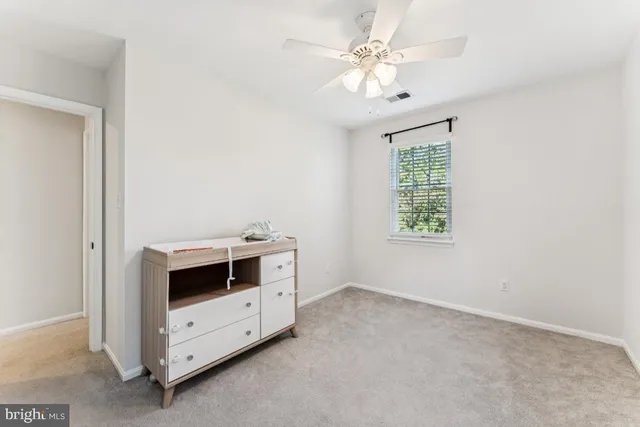 an entryway with fireplace and window