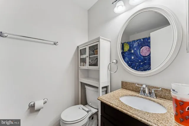 a spacious bedroom with a bed and a window