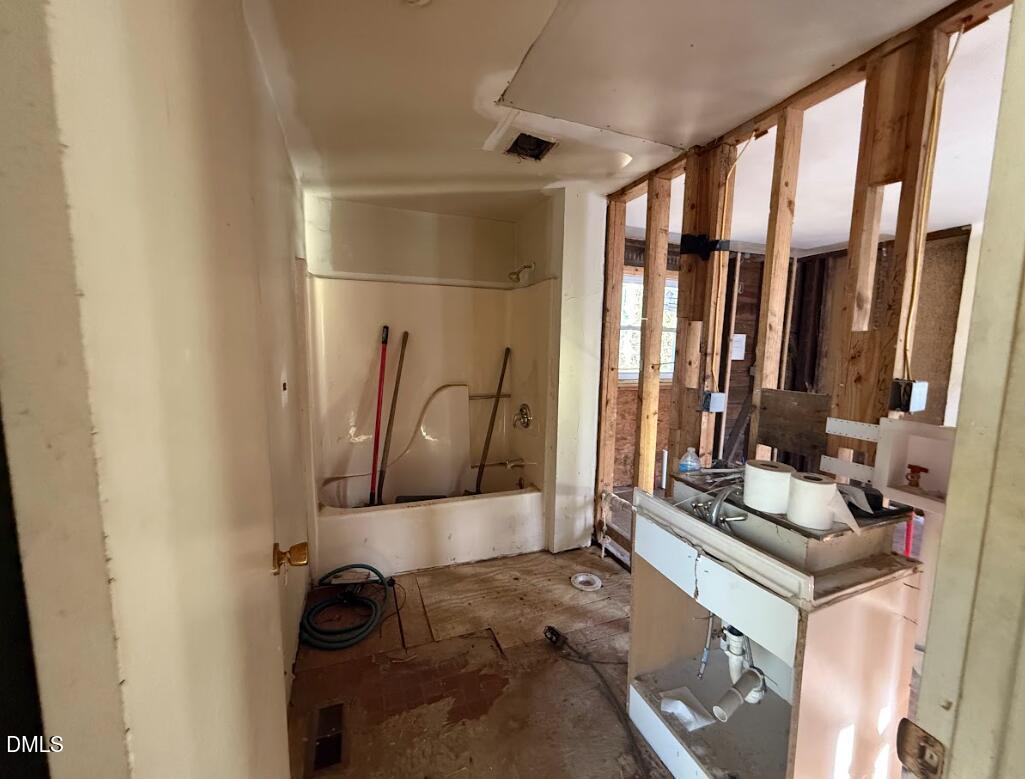 116 East Umstead Street Durham, NC 27707 - Photo 6 of 12 a bathroom with a mirror and a shower