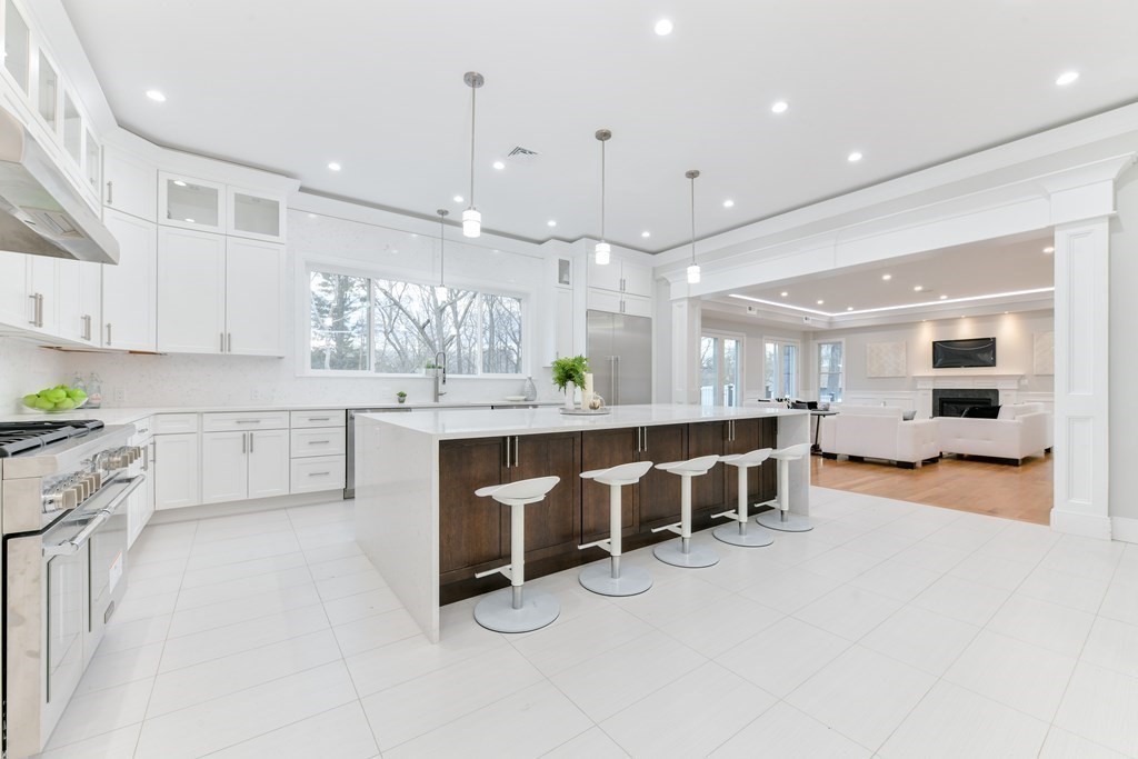 70 Helene Road Newton, MA 02468 - Photo 11 of 35 a large white kitchen with a large window