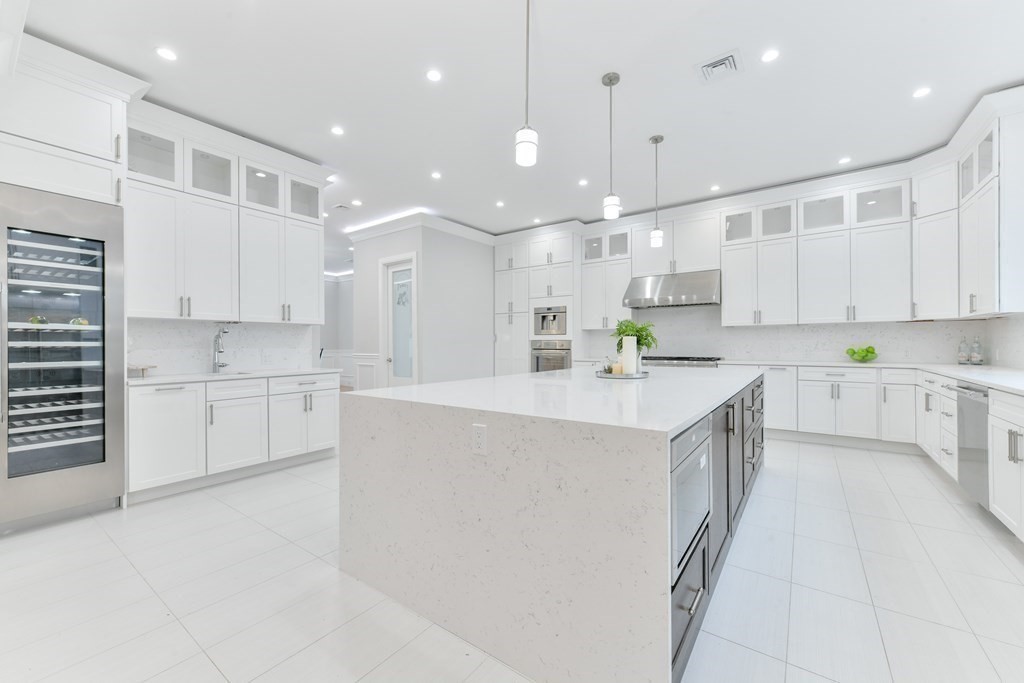 70 Helene Road Newton, MA 02468 - Photo 12 of 35 a kitchen with kitchen island a white counter top space cabinets and appliances