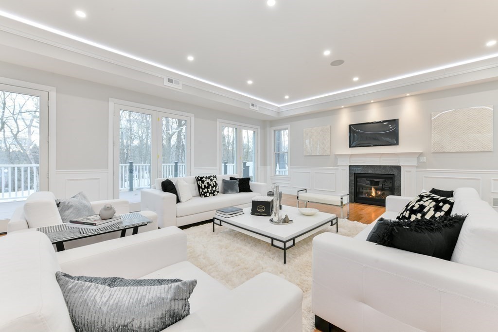70 Helene Road Newton, MA 02468 - Photo 14 of 35 a living room with furniture fireplace and window