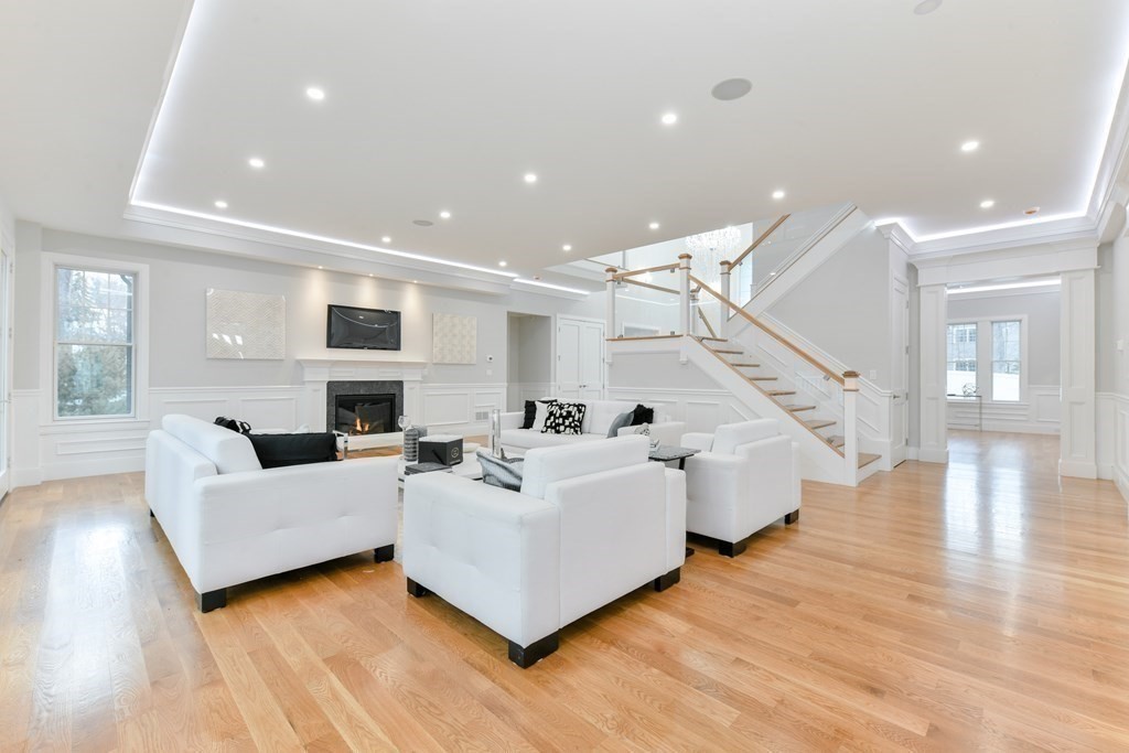 70 Helene Road Newton, MA 02468 - Photo 15 of 35 a living room with fireplace furniture and a wooden floor