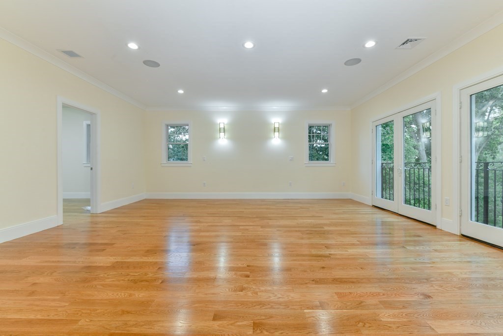 70 Helene Road Newton, MA 02468 - Photo 20 of 35 a view of empty room with wooden floor and fan