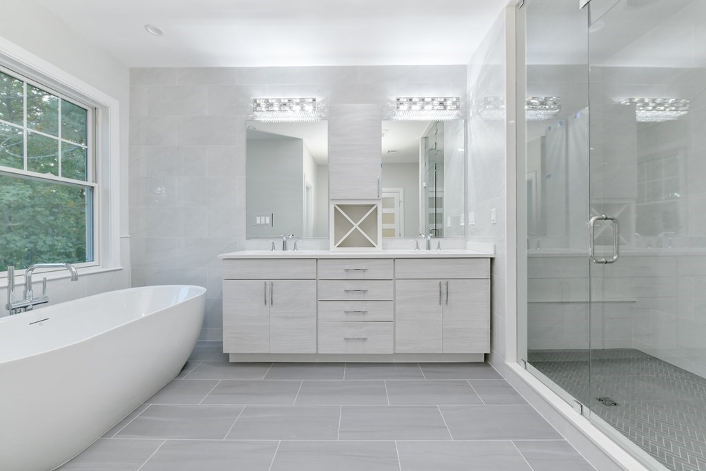 70 Helene Road Newton, MA 02468 - Photo 24 of 35 a spacious bathroom with a double vanity sink shower and mirror