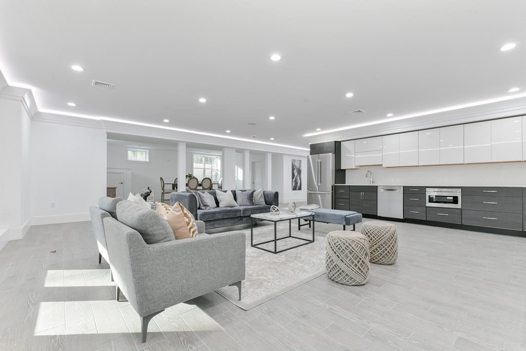 70 Helene Road Newton, MA 02468 - Photo 26 of 35 a living room with furniture and a fireplace