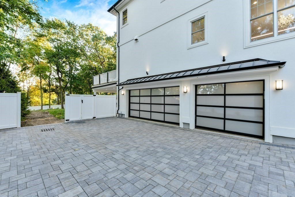 70 Helene Road Newton, MA 02468 - Photo 29 of 35 a view of a house with a garage and bed