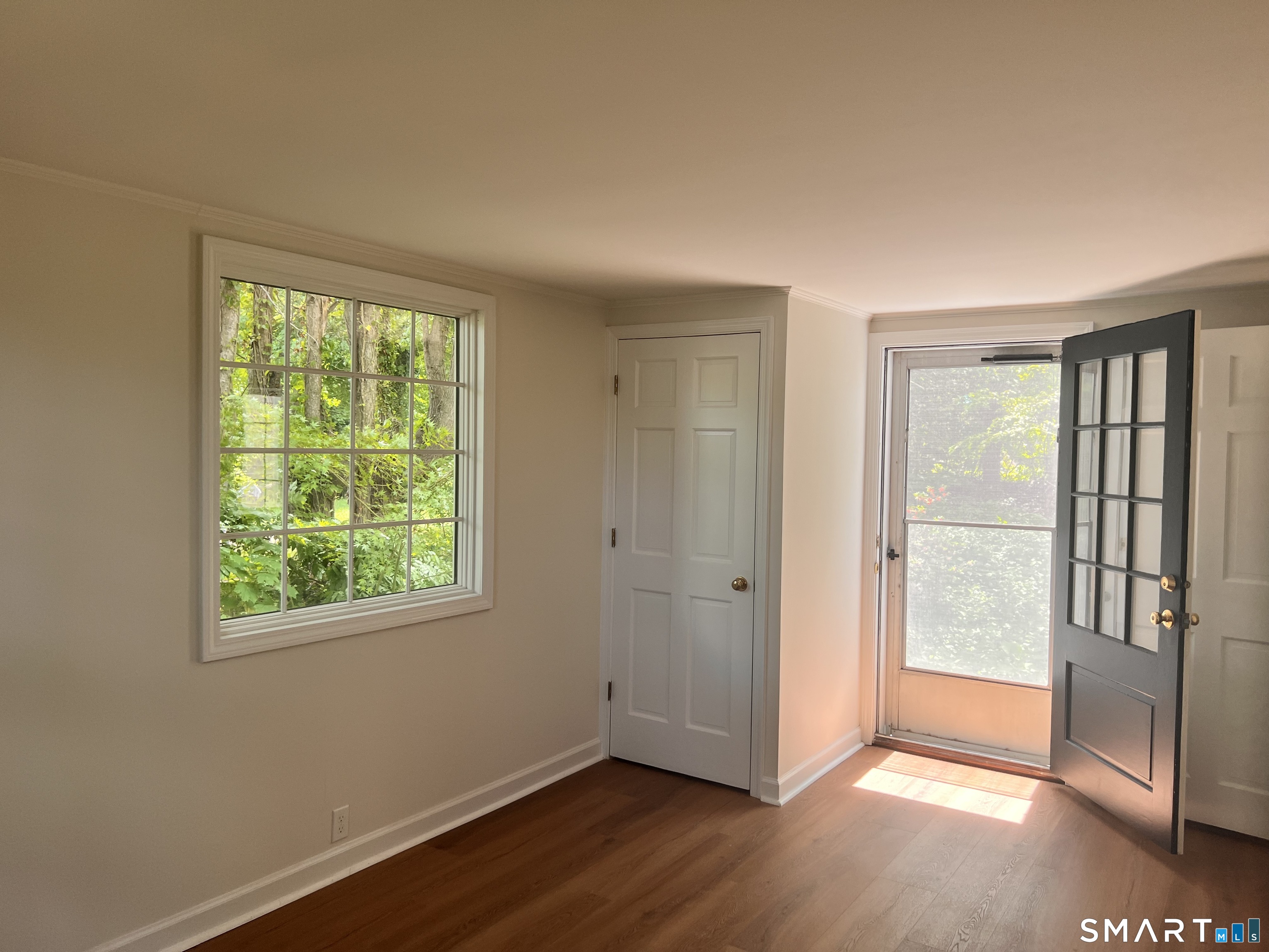 23 Norway Road North Haven, CT 06473 - Photo 18 of 32 a view of an empty room with wooden floor and a window