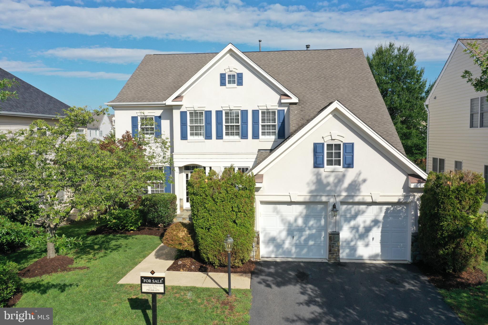 43708 Red House Drive Leesburg, VA 20176 - Photo 1 of 39 a front view of a house with a yard