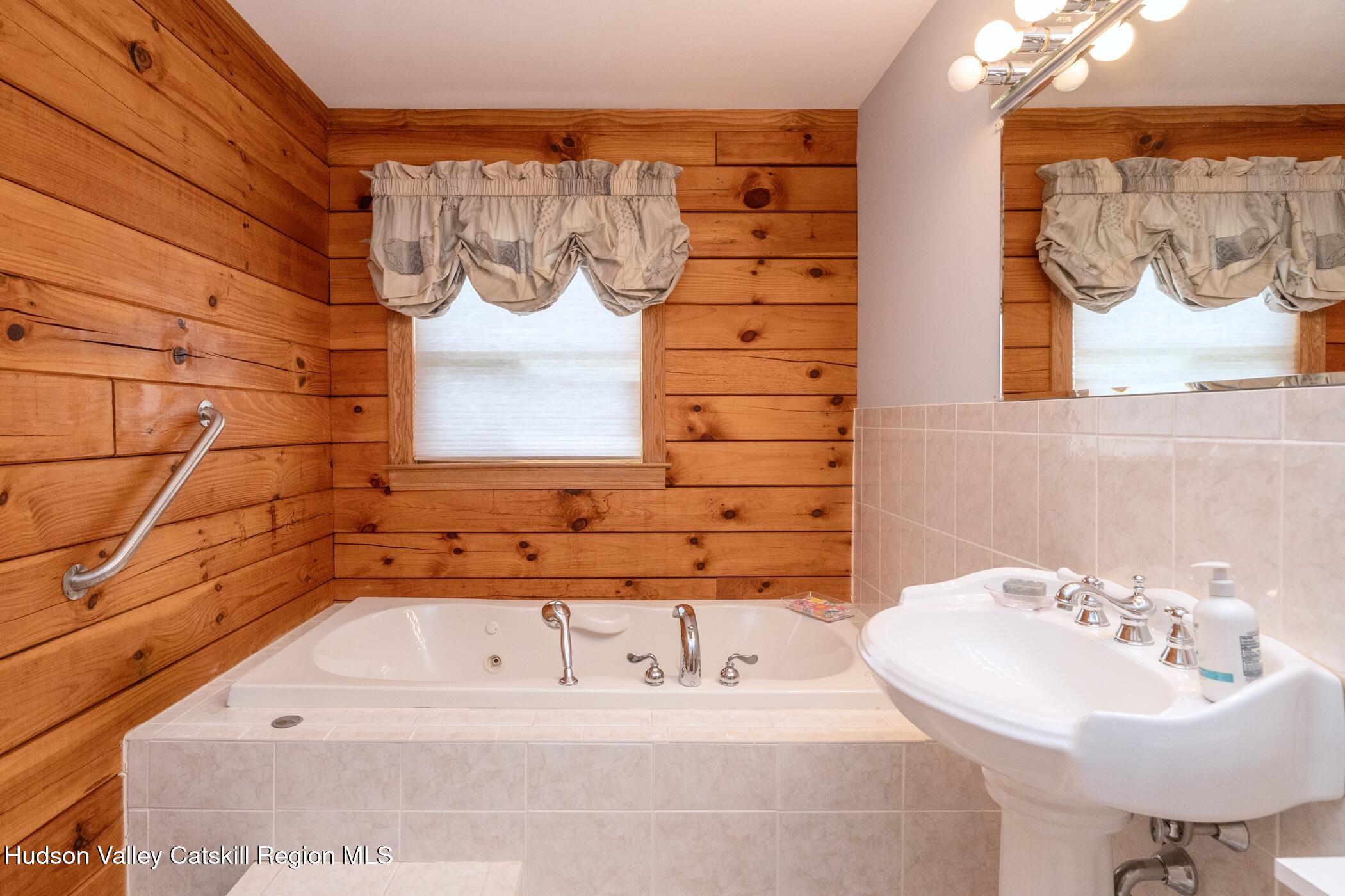 140 Stone Dock Road High Falls, NY 12440 - Photo 18 of 42 a bathroom with a sink and a mirror