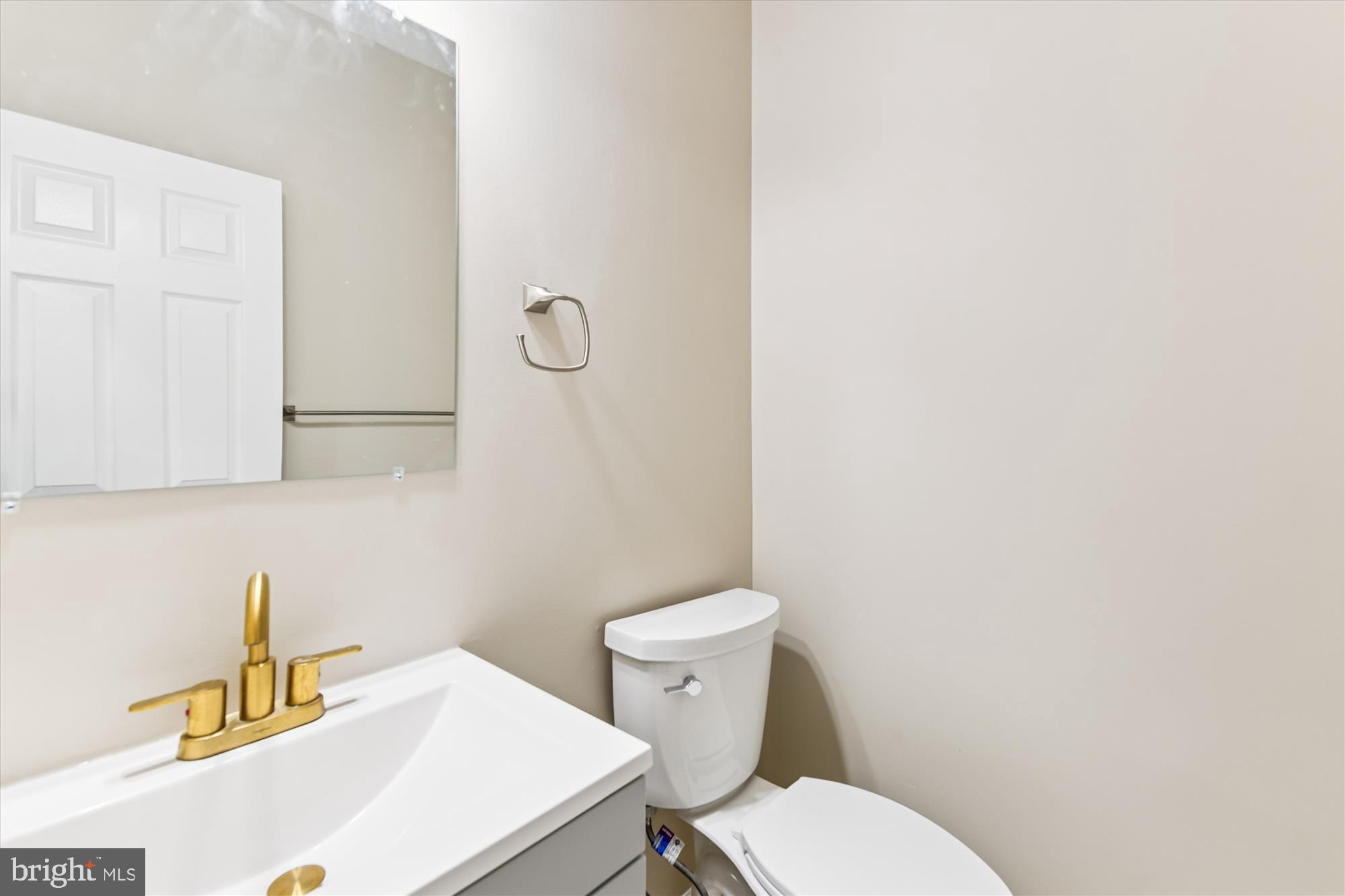 1375 Tralee Circle Aberdeen, MD 21001 - Photo 11 of 41 a bathroom with a sink a toilet and a mirror