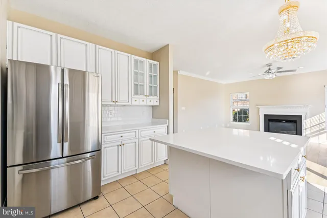 a kitchen with stainless steel appliances a refrigerator sink and cabinets