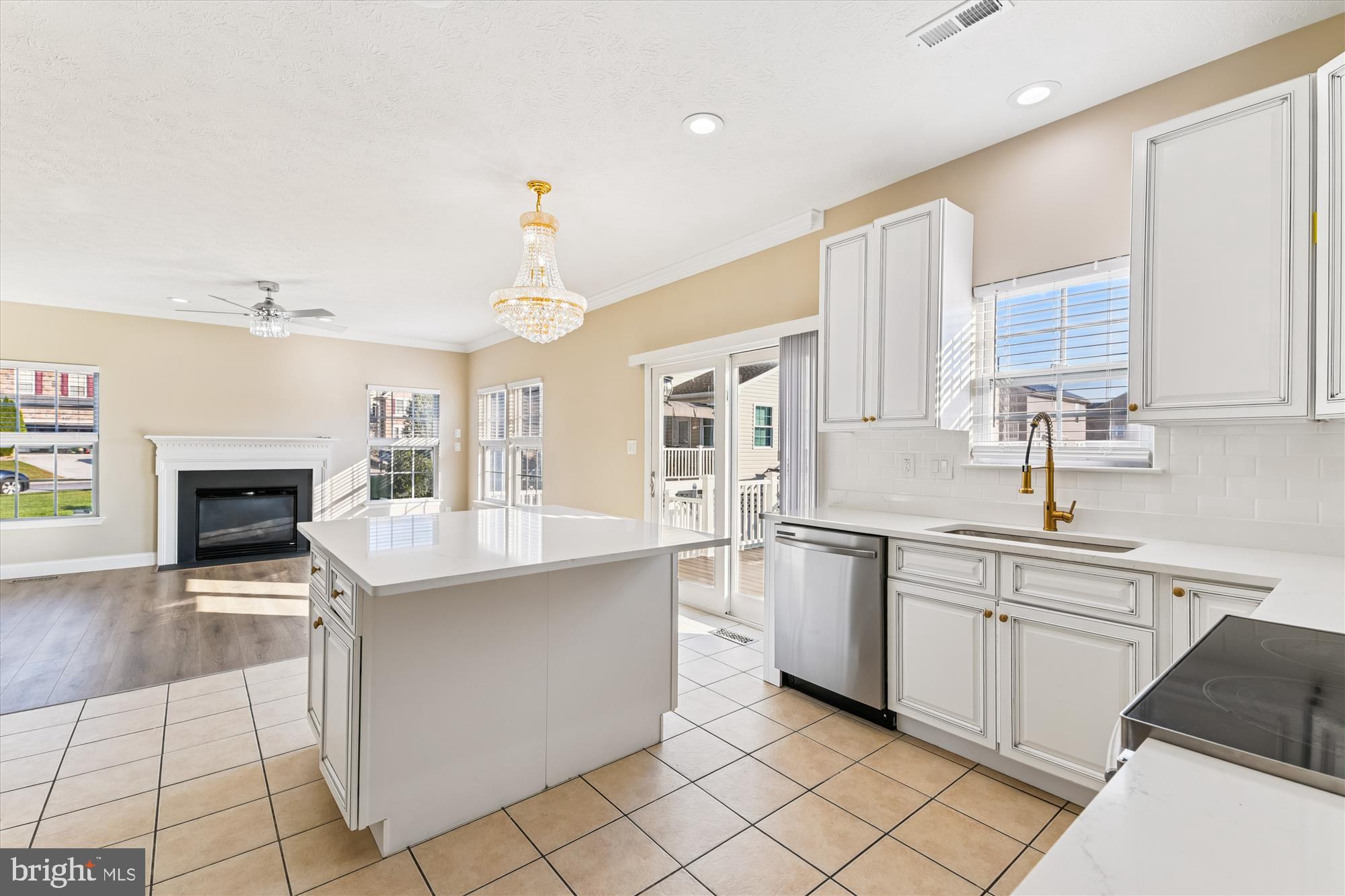1375 Tralee Circle Aberdeen, MD 21001 - Photo 2 of 41 a kitchen with stainless steel appliances a sink counter space cabinets and a fireplace