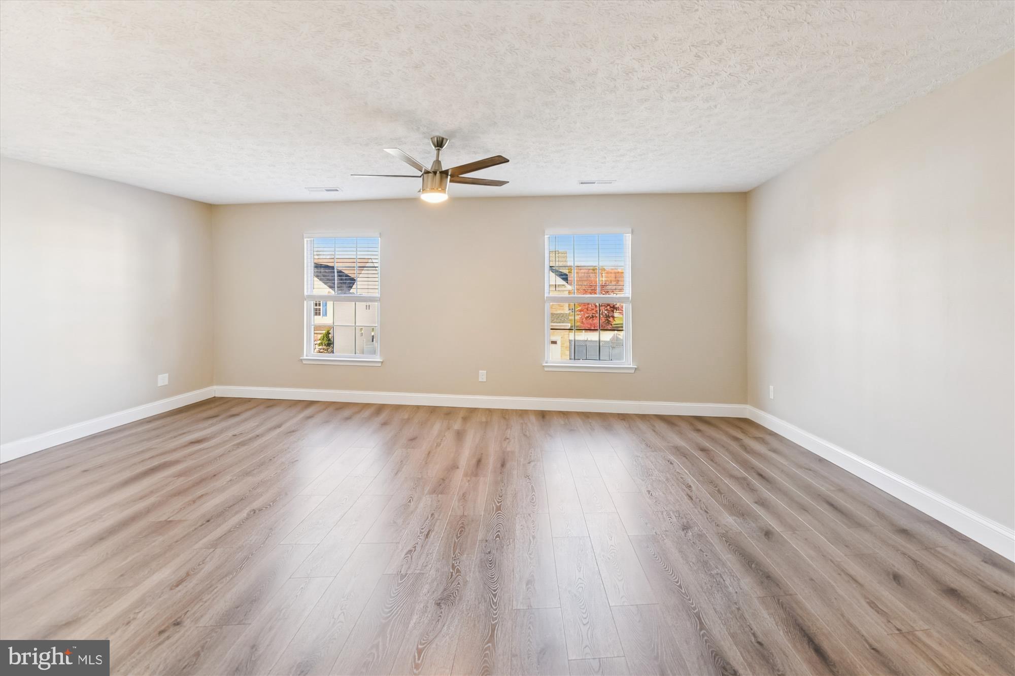 1375 Tralee Circle Aberdeen, MD 21001 - Photo 25 of 41 an empty room with wooden floor window and ceiling fan