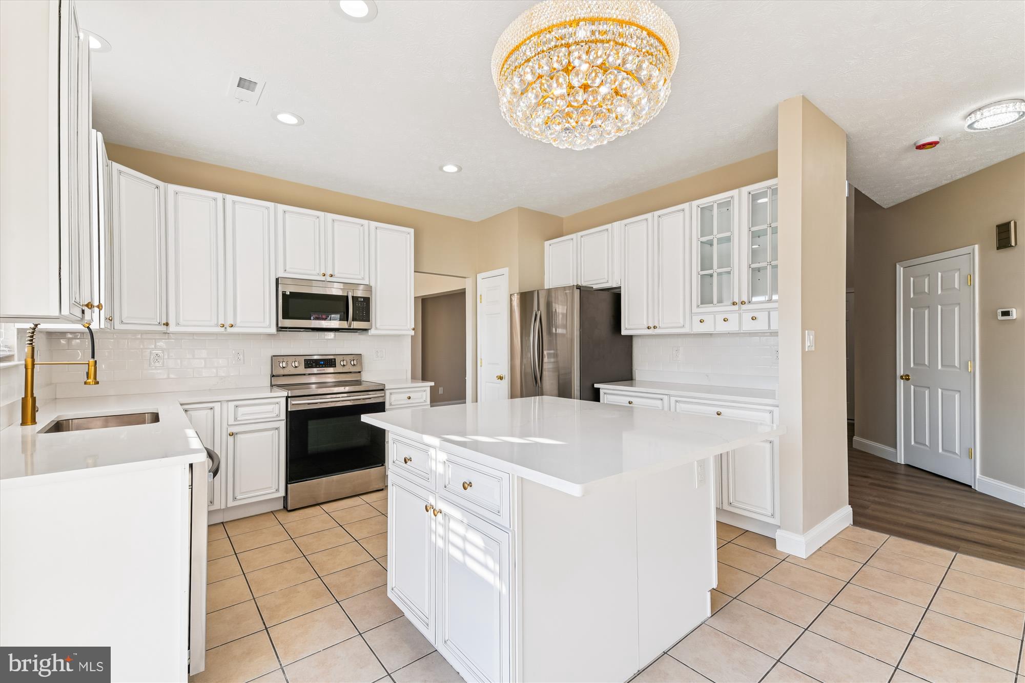1375 Tralee Circle Aberdeen, MD 21001 - Photo 7 of 41 a kitchen with appliances cabinets and a table
