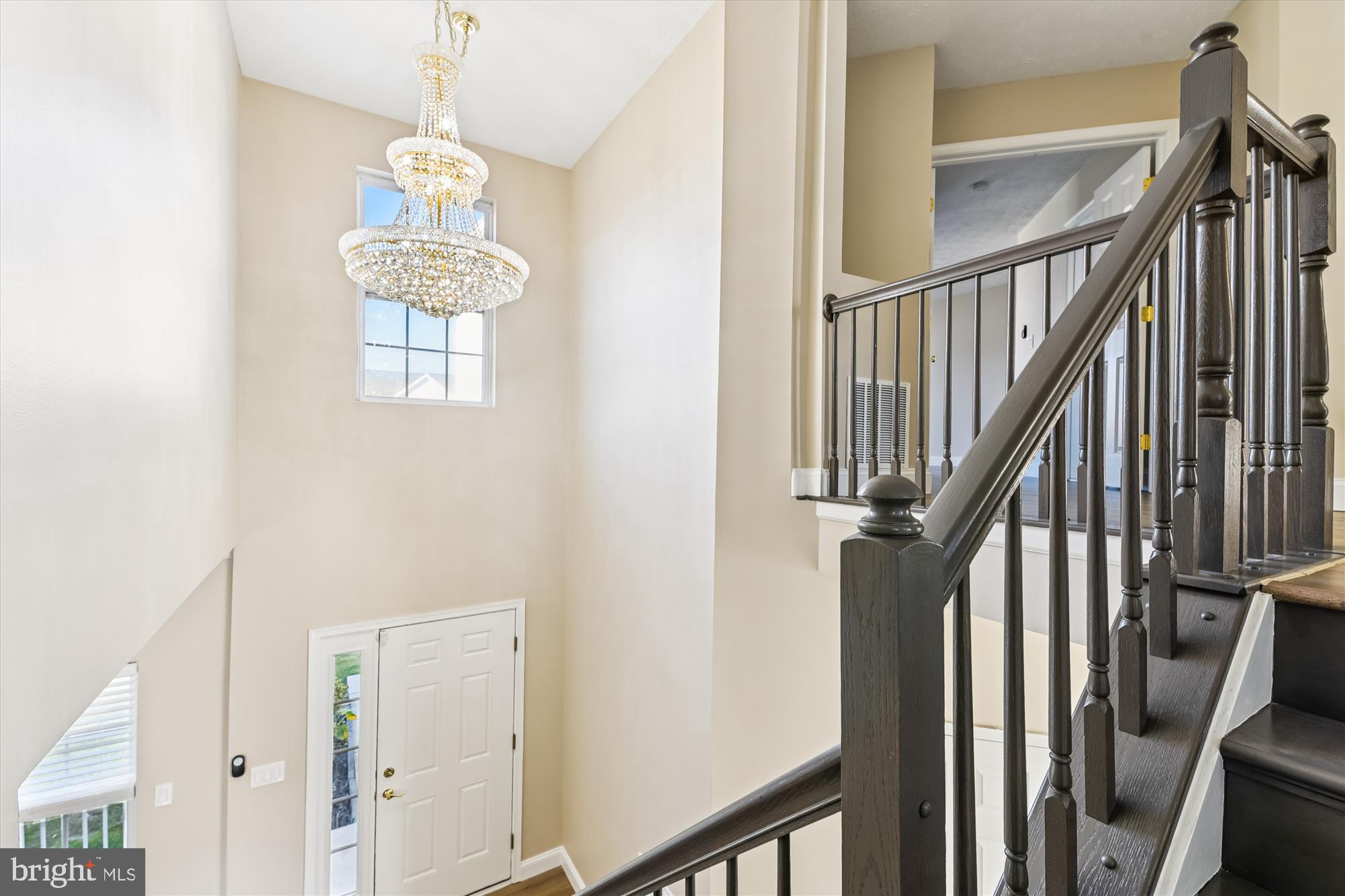1375 Tralee Circle Aberdeen, MD 21001 - Photo 8 of 41 a view of a hallway with wooden floor and chandelier