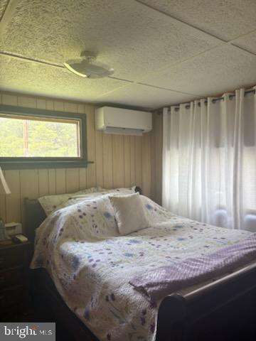 342 Big Maple Lane Schellsburg, PA 15559 - Photo 19 of 27 a bedroom with a bed and a window