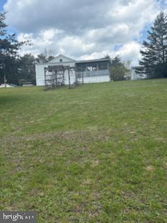 342 Big Maple Lane Schellsburg, PA 15559 - Photo 6 of 27 a view of a large body of water with a building in the background