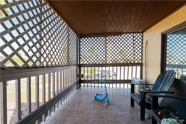 a view of balcony with wooden fence