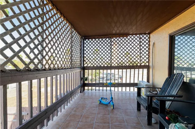 a view of balcony with wooden fence