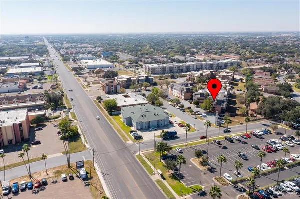 an aerial view of residential houses with outdoor space