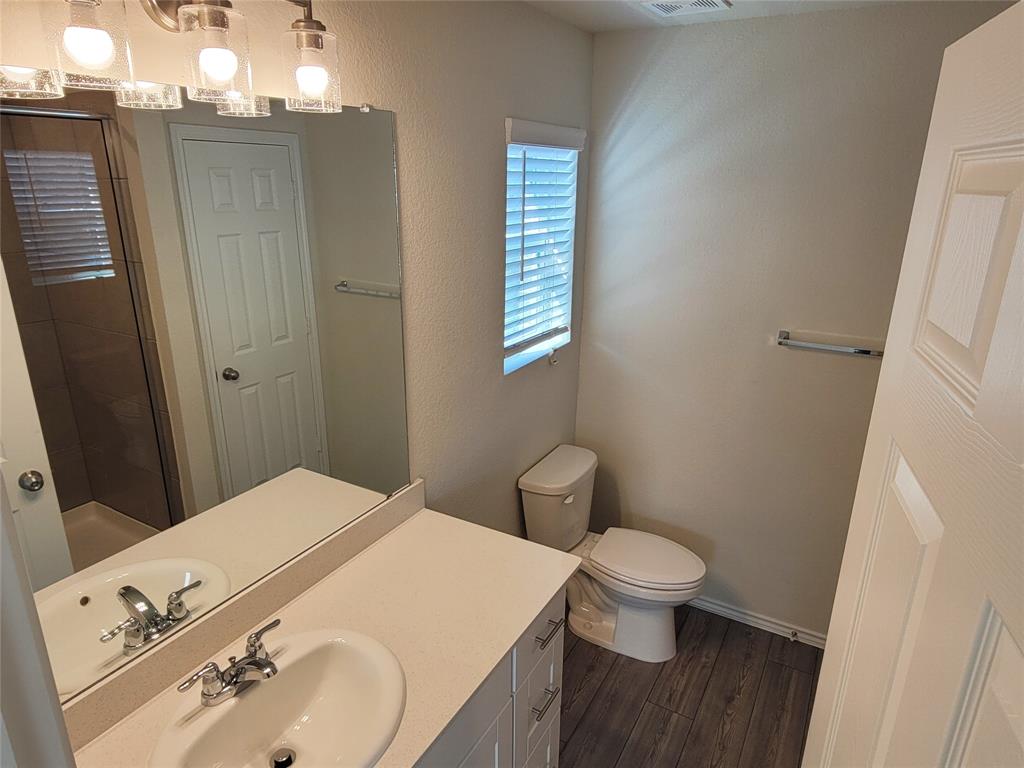 1049 Knightly Lane Haslet, TX 76052 - Photo 12 of 19 a bathroom with a sink and a toilet