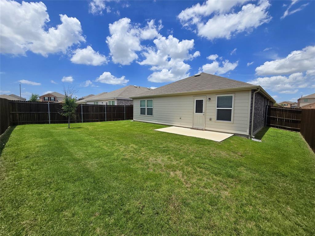 1049 Knightly Lane Haslet, TX 76052 - Photo 17 of 19 a view of a house with a yard