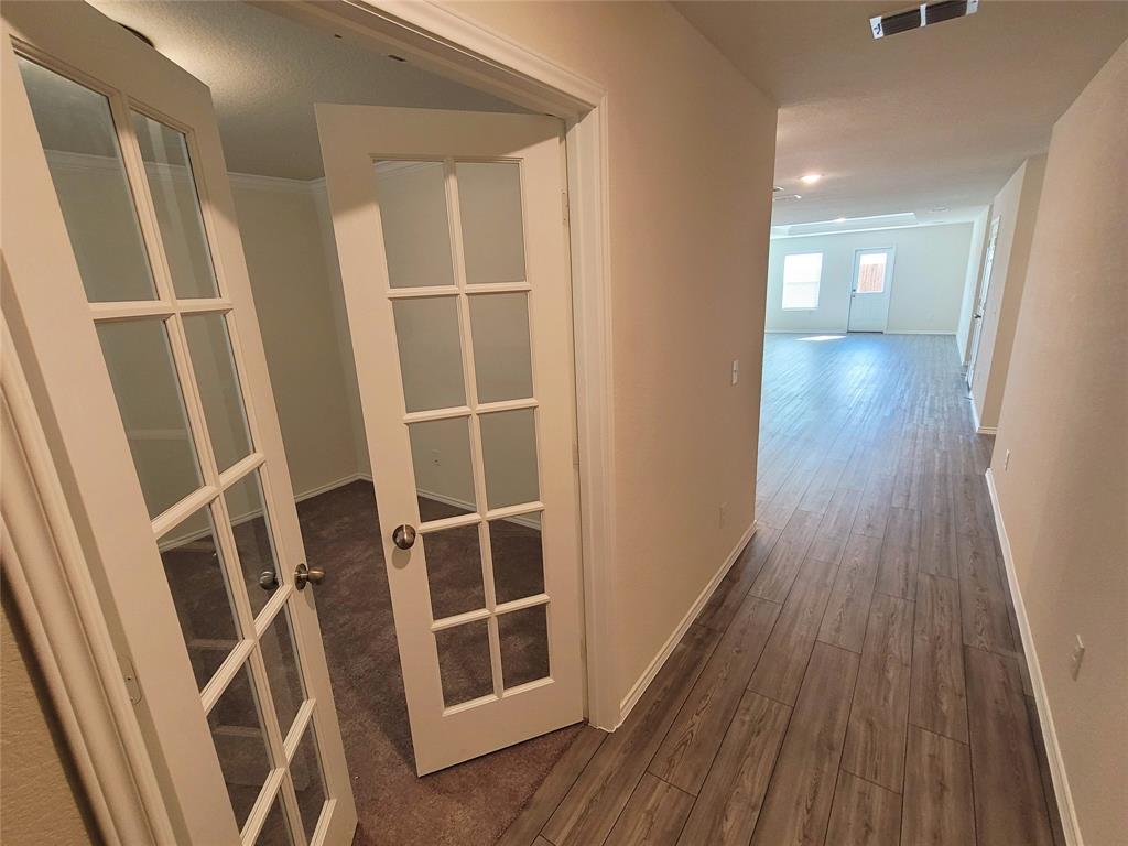 1049 Knightly Lane Haslet, TX 76052 - Photo 2 of 19 a view of entryway with wooden floor