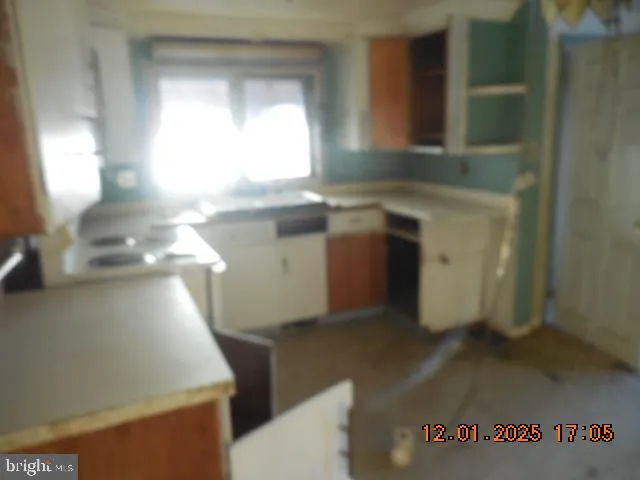 a utility room with sink dryer and washer