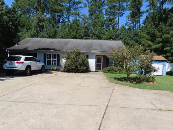 a view of house with outdoor space and street view