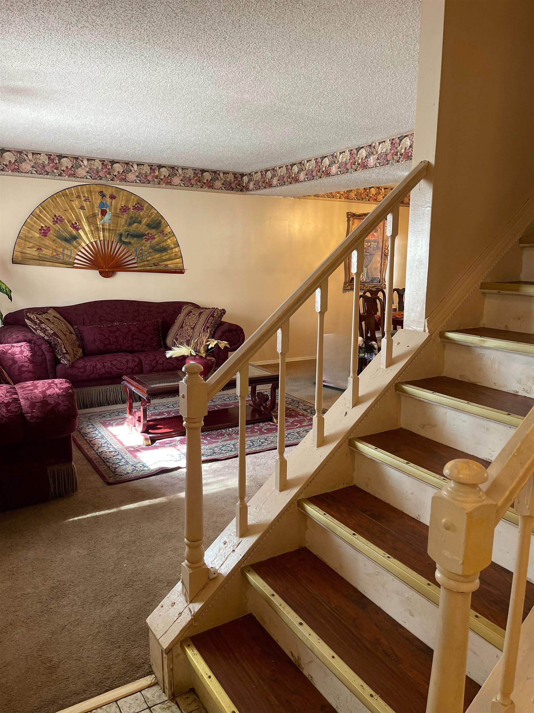 7380 Isherwood Road Memphis, TN 38125 - Photo 2 of 34 Stairs at front entrance of foyer. Hallway leading to kitchen and half bath right of stairs. Laundry Room in hallway, right of stair. Laundry room opens to garage.