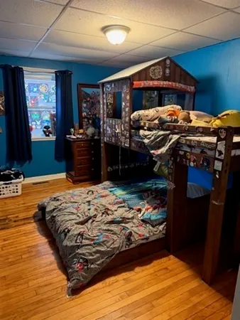 a bedroom with a bed and a closet