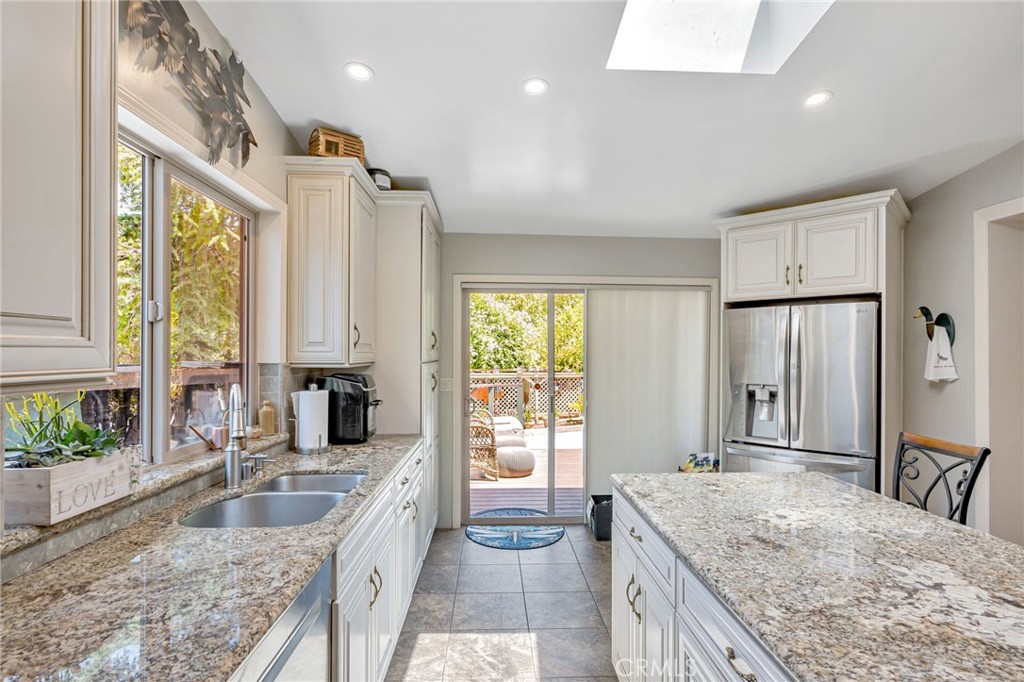 1126 Katherine Road Simi Valley, CA 93063 - Photo 14 of 66 a large bathroom with a granite countertop tub sink and mirror