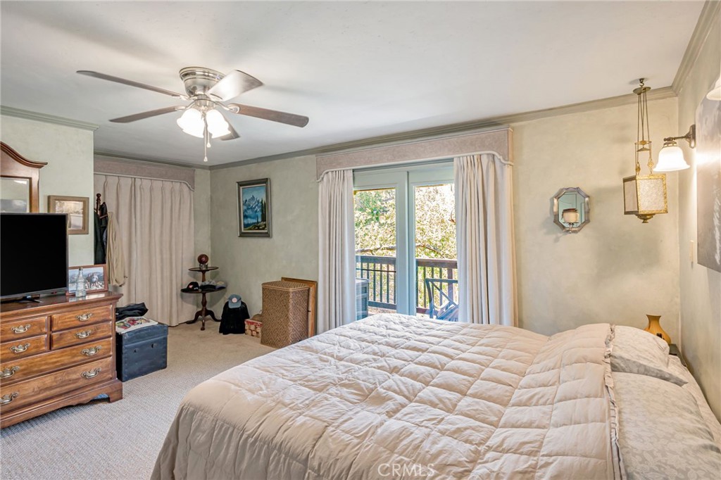 1126 Katherine Road Simi Valley, CA 93063 - Photo 27 of 66 a bedroom with a bed and a flat screen tv