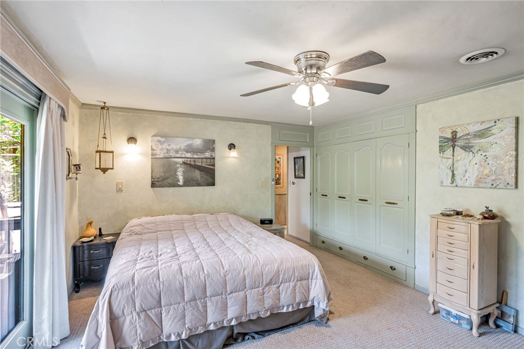 1126 Katherine Road Simi Valley, CA 93063 - Photo 28 of 66 a bedroom with a large bed and a chandelier