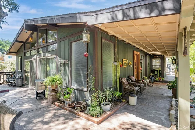 a view of a chairs and table in the patio