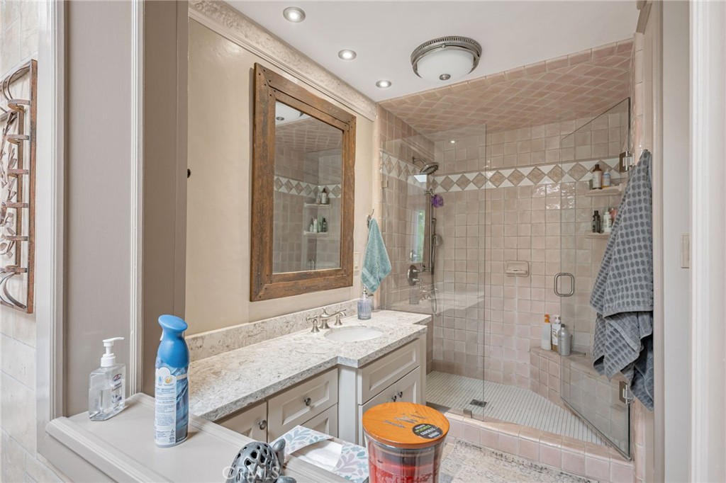 1126 Katherine Road Simi Valley, CA 93063 - Photo 33 of 66 a bathroom with a granite countertop sink toilet and shower