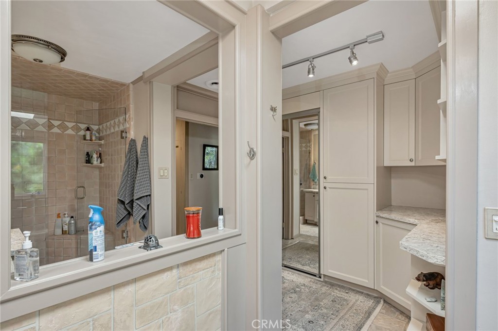 1126 Katherine Road Simi Valley, CA 93063 - Photo 35 of 66 a bathroom with a shower sink and mirror