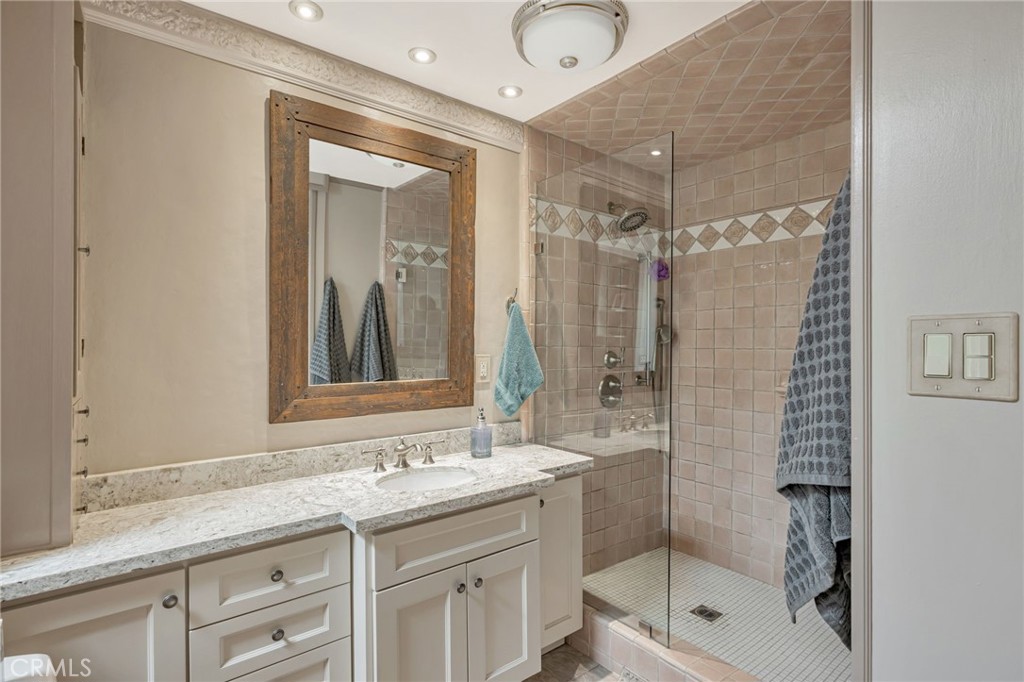 1126 Katherine Road Simi Valley, CA 93063 - Photo 36 of 66 a bathroom with a shower sink and mirror