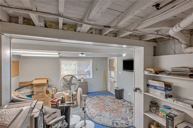 a view of a patio with table and chairs and potted plants
