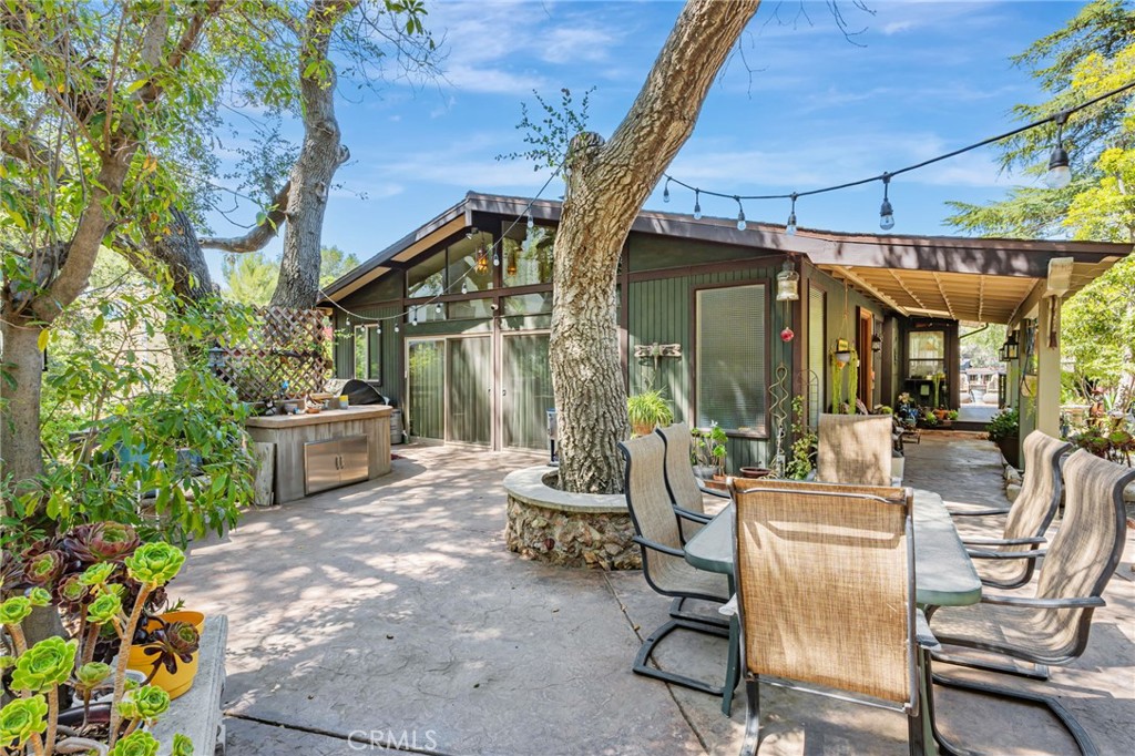 1126 Katherine Road Simi Valley, CA 93063 - Photo 49 of 66 a view of a patio with table and chairs and potted plants