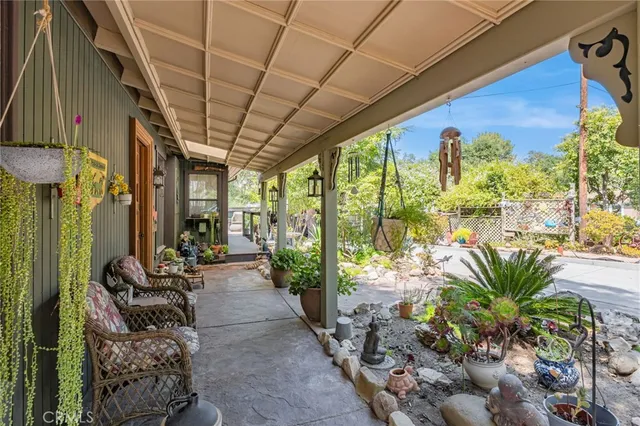 a living room filled with furniture and a potted plant
