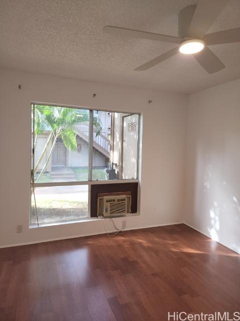 Undisclosed Address Ewa Beach, HI 96706 - Photo 20 of 22 an empty room with wooden floor and windows